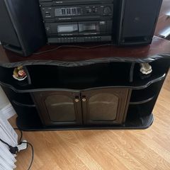 Traditional dark wood corner TV/display unit in good used condition.