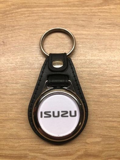 Brand new synthetic leather Isuzu key ring with shopping trolley token/coin