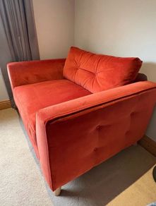 DFS Grand Designs orange velvet cuddler armchair/small sofa