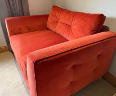 DFS Grand Designs orange velvet cuddler armchair/small sofa