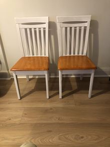 A pair of kitchen dining chairs