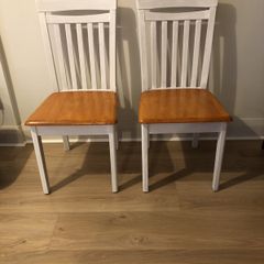 A pair of kitchen dining chairs
