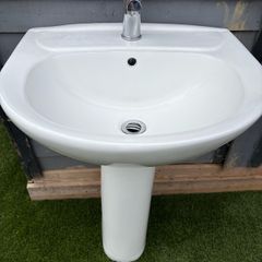 Sink with pedestal and tap