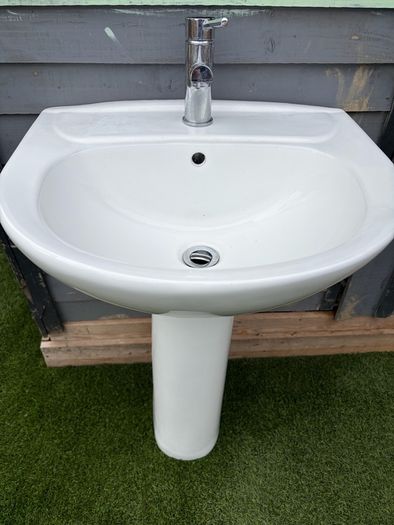 Sink with pedestal and tap