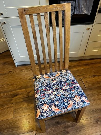 Solid oak dining table & 6 reupholstered dining chairs