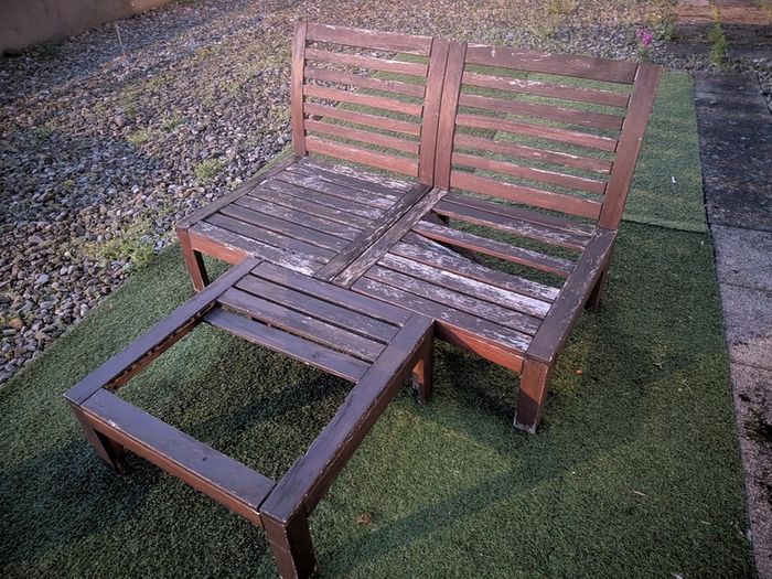 Wooden outdoor lounger with cushions