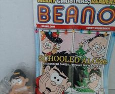 old beano comic and new toy in wrapping