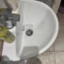 Bathroom sink, toilet, radiator Image 6