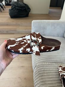 Cow print mules Pull and Bear