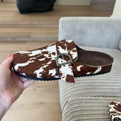 Cow print mules Pull and Bear