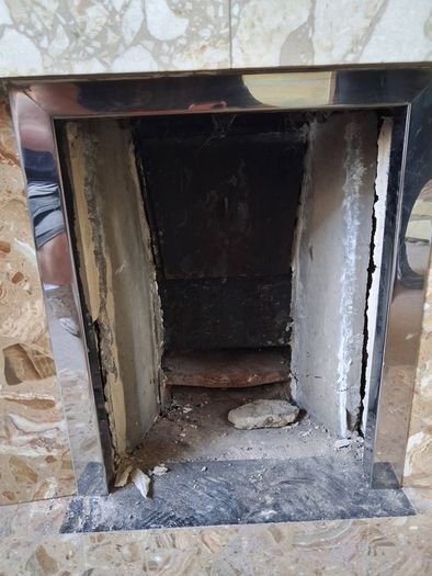 Tiled fireplace with chrome inner surround