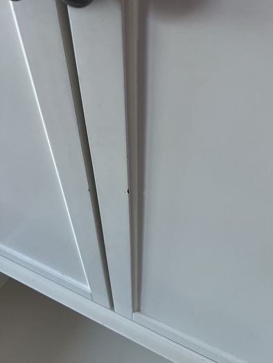White double door high wardrobe with bottom drawer and shelf