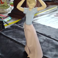 Getting Ready A Young Girl Fixing Her Hair from Nao Porcelain, Lladro, postage available or collection