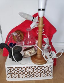 A bundle of household items including wooden table lamp, clip on light,crystal basket vase