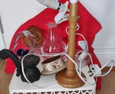 A bundle of household items including wooden table lamp, clip on light,crystal basket vase
