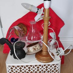 A bundle of household items including wooden table lamp, clip on light,crystal basket vase