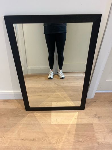 Black framed bevelled mirror