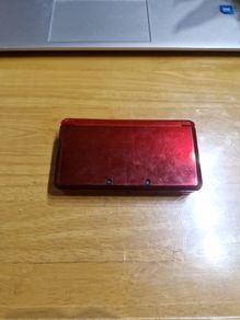 Nintendo 3DS Metallic Red with the original box, charger, and booklets