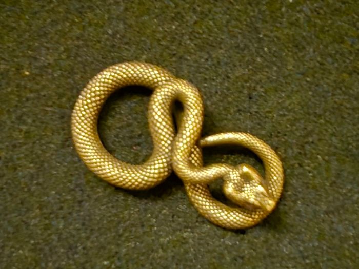 3 brass snakes.