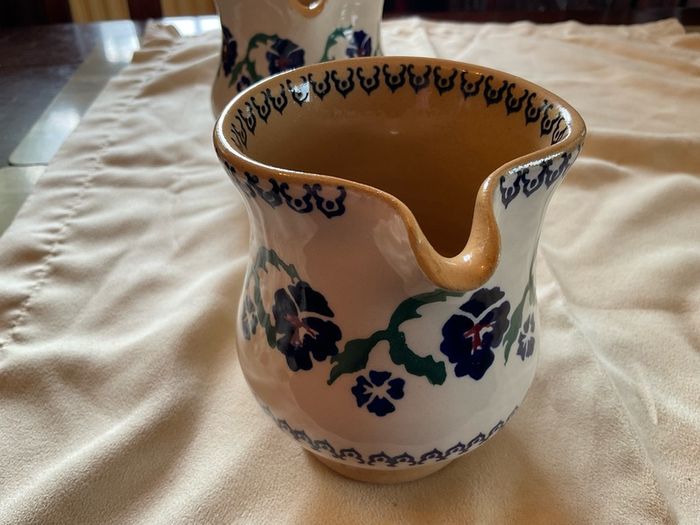 Nicholas Mosse two pansy jugs .  Both 4 inches  in height