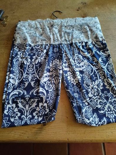 blue and white leggings with damask print with a white lace waistband. New never worn.