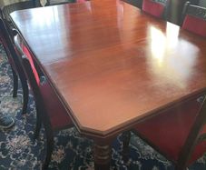 antique table and 6 velvet chairs