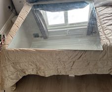 big rimless mirror that screw to wall. Have the 4 screws. In perfect condition. Box for transport