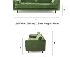 A stunning and comfortable green velvet sofa