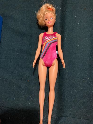 Two Barbie Dolls.