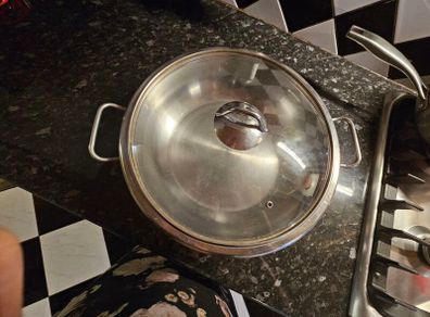 stainless steel wok and 3 serving platers