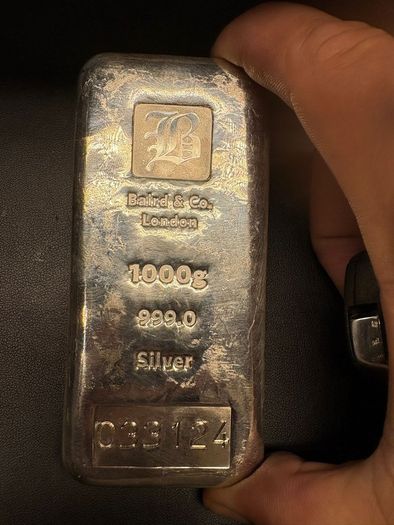 a 1-kilogram silver bar made by Baird & Co. London