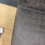 Grey quilted sofa with white metal frame Image 4