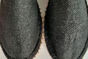 new flat black shoes with a little sparkle tag attached