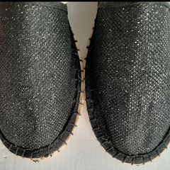 new flat black shoes with a little sparkle tag attached