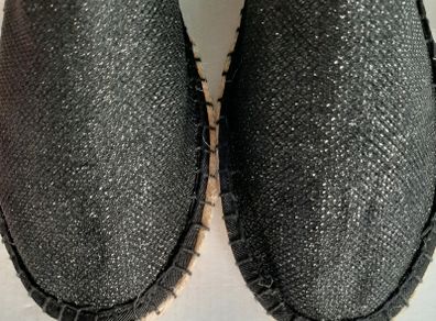 new flat black shoes with a little sparkle tag attached