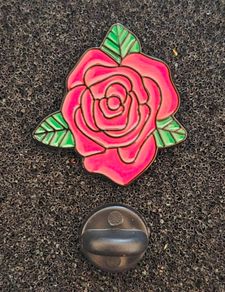 Rose ,  pin back badge.