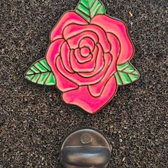 Rose ,  pin back badge.