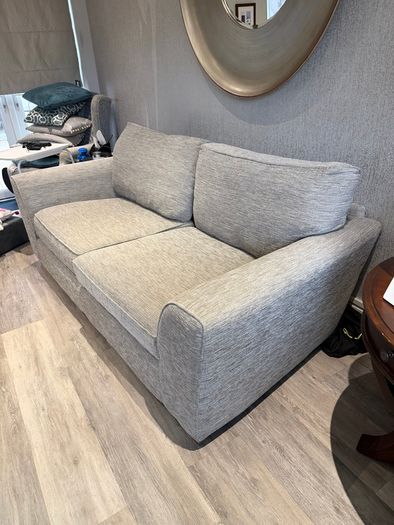 Grey fabric two-seater sofa