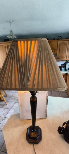 Vintage ebonized table lamp featuring an octagonal base, likely dating from the early 20th century.