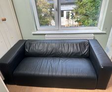 Black 2 seater sofa with removable legs