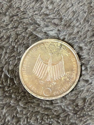 This is a German 10 Deutsche Mark (DM) silver commemorative coin issued in 1997 to mark the 100th anniversary of the diesel engine