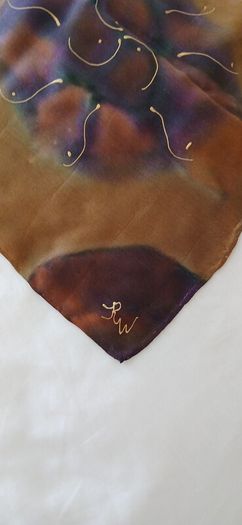 Hand painted, 100% silk scarf featuring a hand-rolled hem and custom metallic gutta detailing.