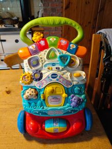 VTech First Steps Baby Walker, a popular 2-in-1 interactive push toy and activity center designed to help toddlers learn to walk.  Working perfectly.