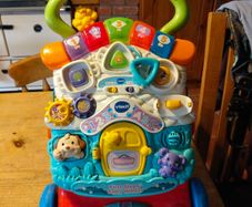 VTech First Steps Baby Walker, a popular 2-in-1 interactive push toy and activity center designed to help toddlers learn to walk.  Working perfectly.