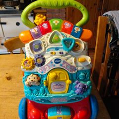 VTech First Steps Baby Walker, a popular 2-in-1 interactive push toy and activity center designed to help toddlers learn to walk.  Working perfectly.