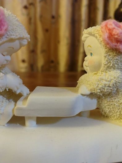 Snowbabies from Department 56. Porcelain.