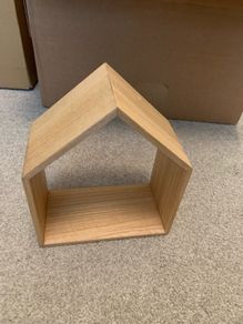 Wooden decoration in the shape of a house