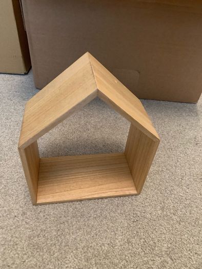 Wooden decoration in the shape of a house