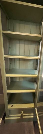 Sage green tall storage cabinet