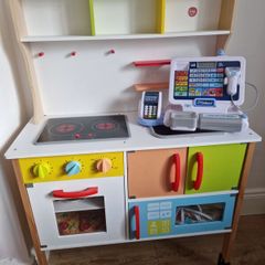 Kid's kitchen with utensils and cash register